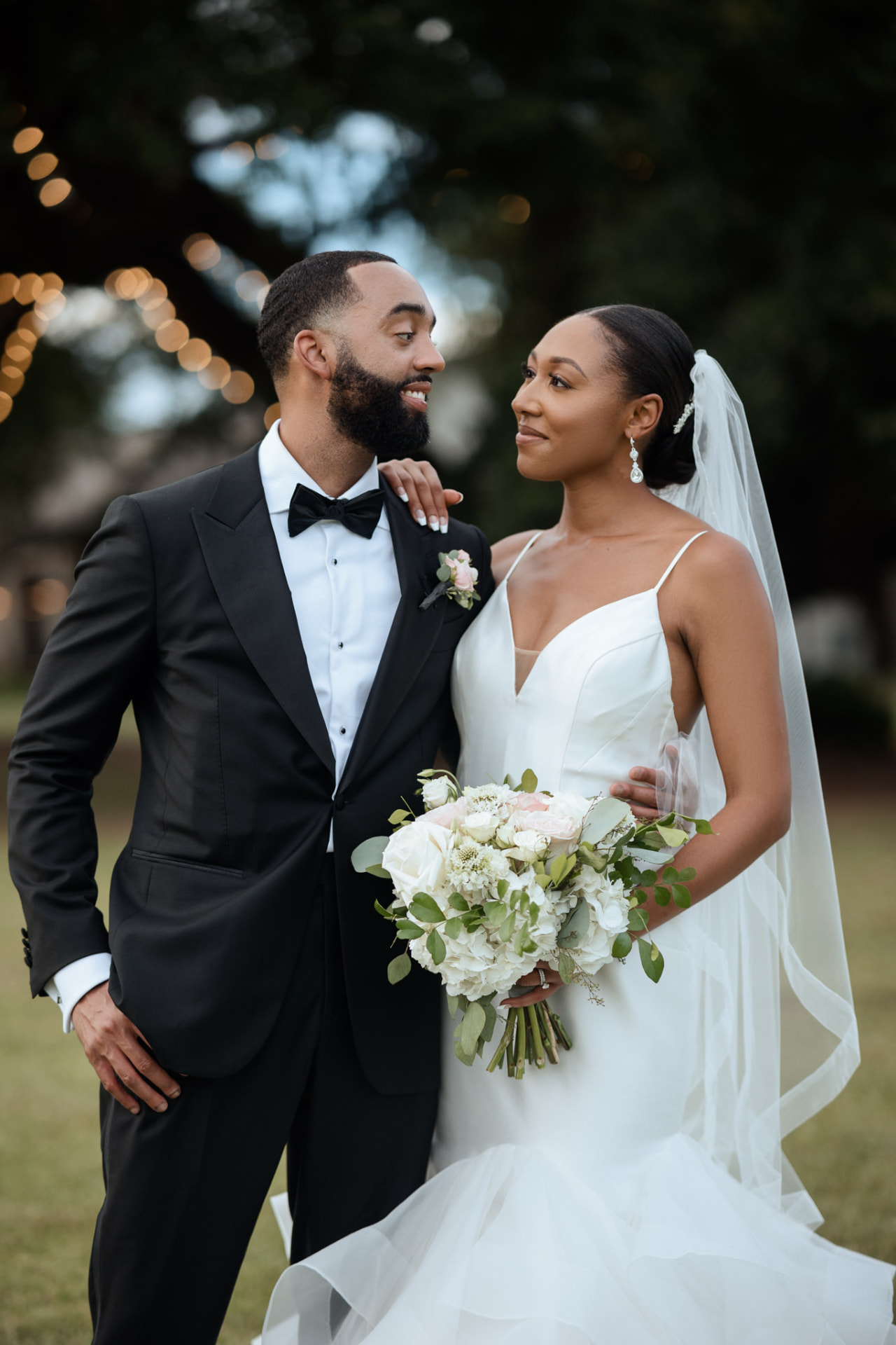 Jerry and Takesha standing together in their wedding attire