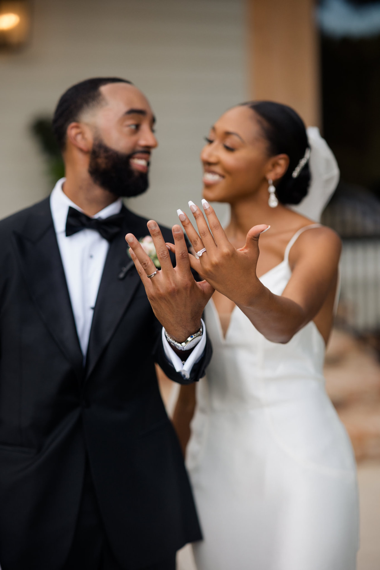 Jerry and Takesha holding up their wedding rings