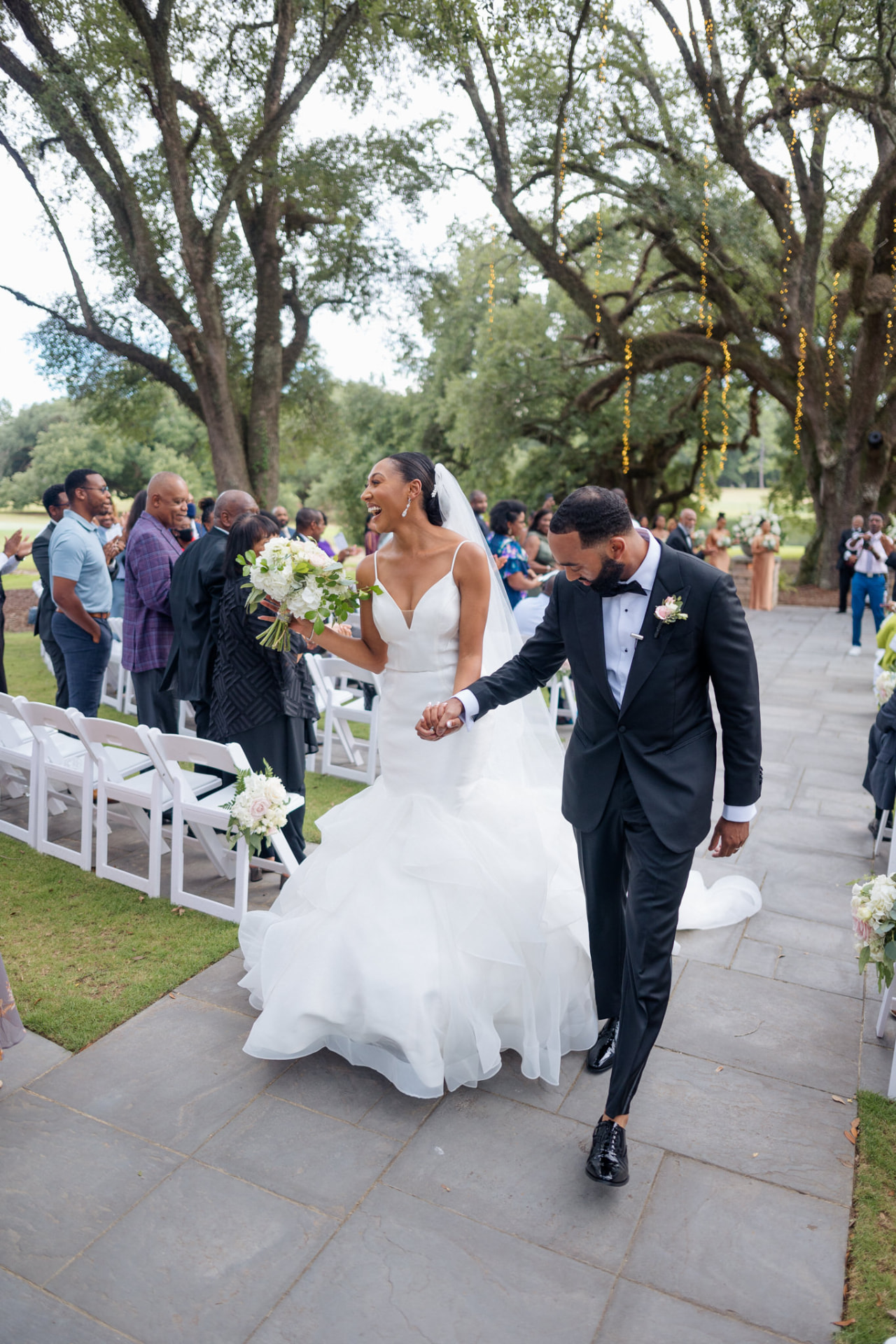 Jerry and Takesha joyfully leaving their outdoor ceremony