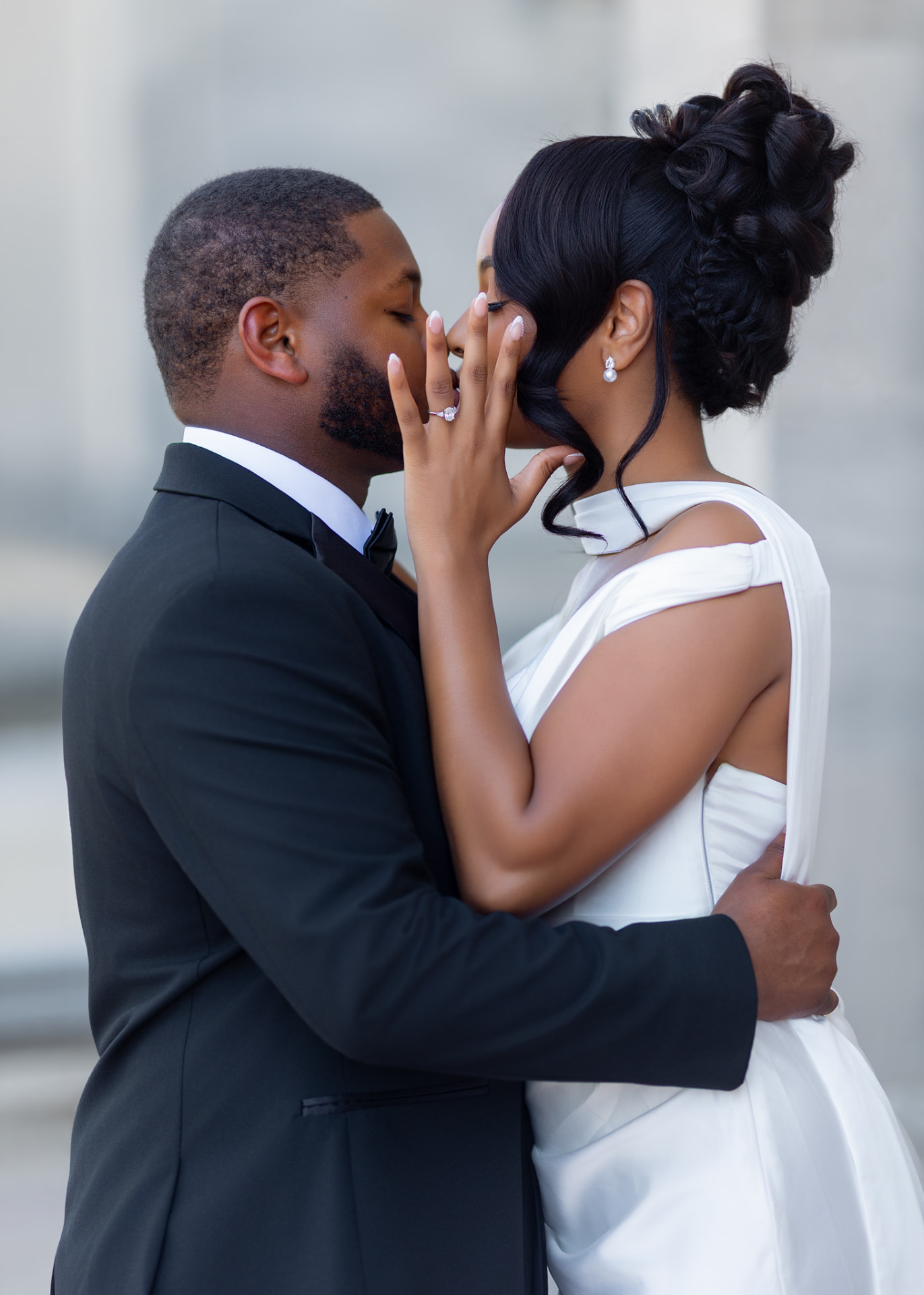Engaged couple kissing in a close portrait